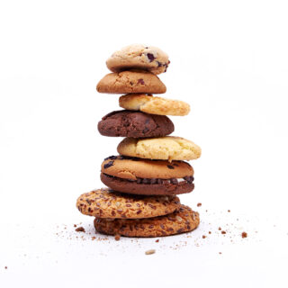 Stack of baked cookies with a variety of flavours. Created by UK food manufacturers using butter supplies from Middledale.